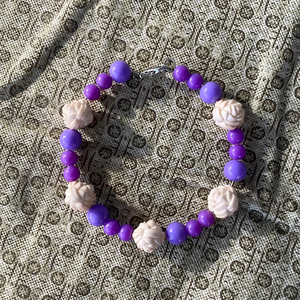 It’s a super cute purple Bracelet with flowers